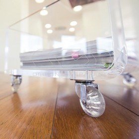 90x40 Acrylic clear rolling TV stand with holder objects.