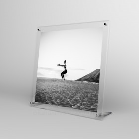 Acrylic 15cm tabletop photo frame with metal supports.