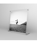 Acrylic 15cm tabletop photo frame with metal supports.