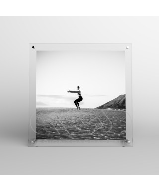 Acrylic 25cm tabletop photo frame with metal supports.
