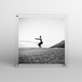 Acrylic 25cm tabletop photo frame with metal supports.