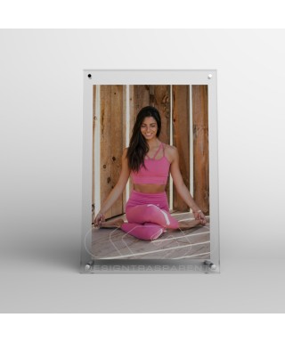 Acrylic 25cm tabletop photo frame with metal supports.