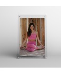 Acrylic 25cm tabletop photo frame with metal supports.