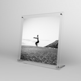 Acrylic 35cm tabletop photo frame with metal supports.