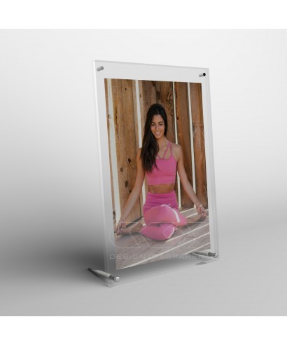 Acrylic 35cm tabletop photo frame with metal supports.