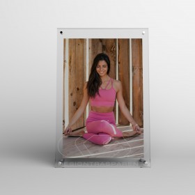 Acrylic 35cm tabletop photo frame with metal supports.