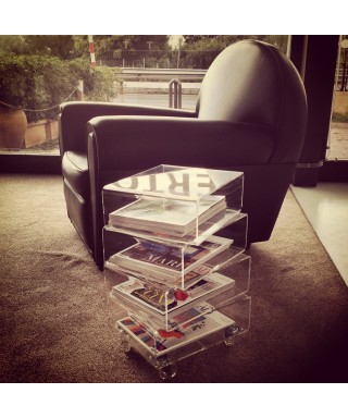 Bedside table magazine rack serving trolley in transparent acrylic.