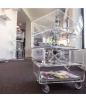 Bedside table magazine rack serving trolley in transparent acrylic.